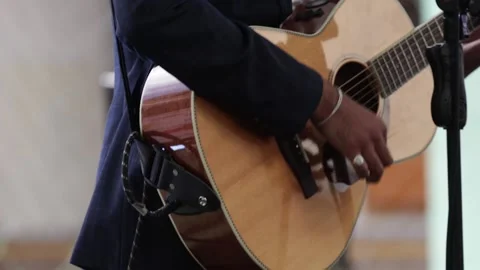 Hands playing an acoustic guitar at a live concert. Stock Footage 221661987