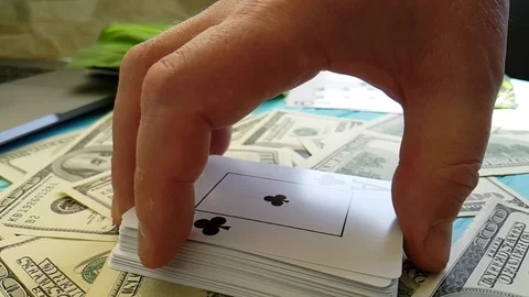 Hands playing cards dollars slow motion Video stock 88141313