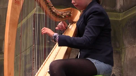Hands playing Celtic harp Stock Footage 43381687