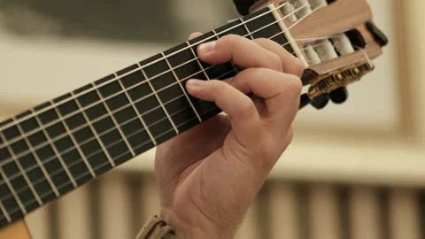 Hands playing classical guitar, close up music lessons. classical teacher Vidéo 295450969
