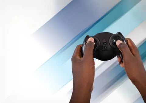 Hands playing with computer game controller with fading background Stock Photos