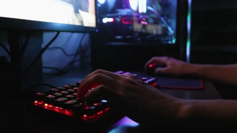 Hands playing computer games in the dark Stock Footage 231798033