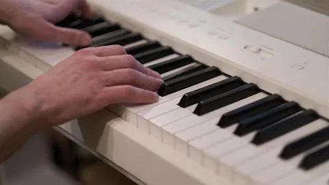 Hands Playing Digital Piano in Soft Natural Light Indoor Scene Stock Footage 331905414