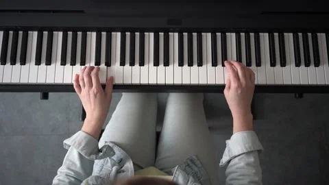 Hands playing on electronic piano Stock Footage 162174896