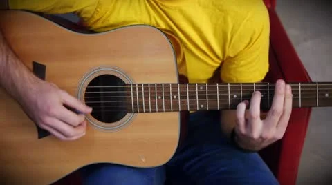 Hands playing on guitar Stockbeeldmateriaal 12413883