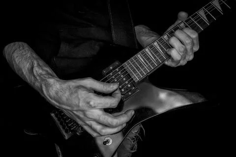 Hands playing guitar Stock Photos