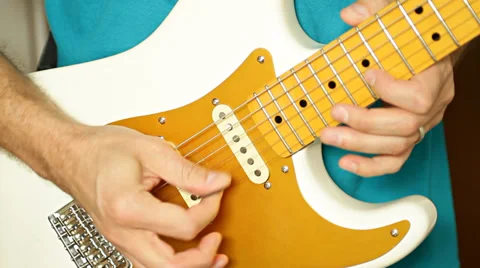 Hands playing guitar solo selective focus on picking fingers Stock Footage 35511905