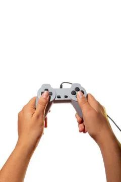 Hands playing with joystick control isolated on white background. Latin woman Fotos de archivo