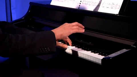 Hands playing the keyboard of a piano. Stock Footage 129875022