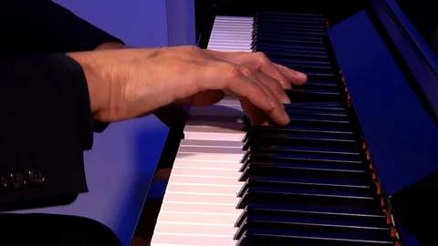 Hands playing the keyboard of a piano. Stock Footage 129875883