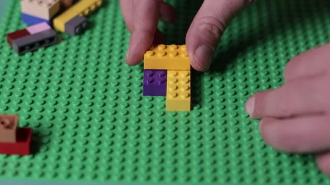 Hands playing with Lego bricks, education and creative concept, adult hands Stock Footage 167342261
