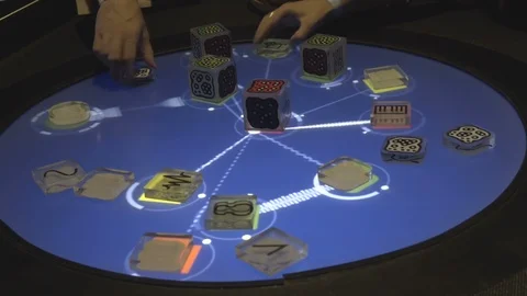 Hands Playing with Peculiar Dice on a interactive table Video stock 96168916