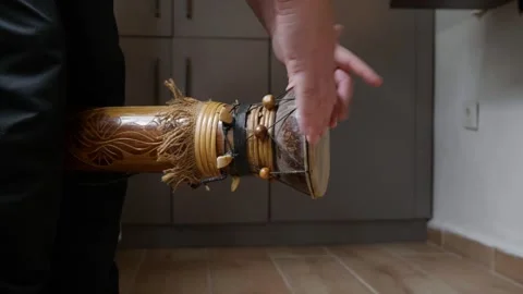 Hands Playing a Percussion Instrument Decorated with Traditional African Fi.. Stock Footage 327209134