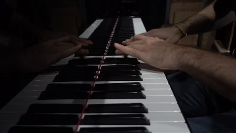 Hands playing the piano close-up low shot.  Video stock 95909600