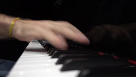Hands playing the piano close-up low shot.  Video stock 95910224