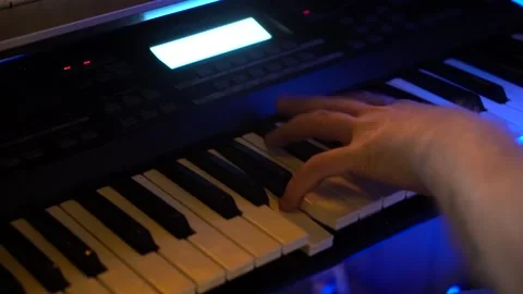 Hands playing on piano electronic keyboard Stock Footage 133772995