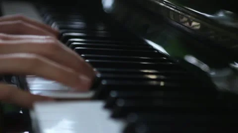 Hands playing piano Stock Footage 12503545