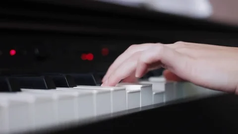 Hands playing piano Stock Footage