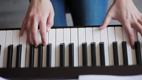 Hands playing piano Stock Footage 76150856