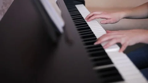 Hands playing piano Stock Footage 76150859