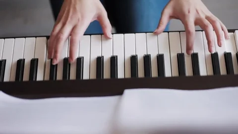 Hands playing piano Stock Footage