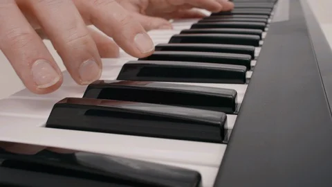 Hands Playing a Piano Stock Footage 128762120