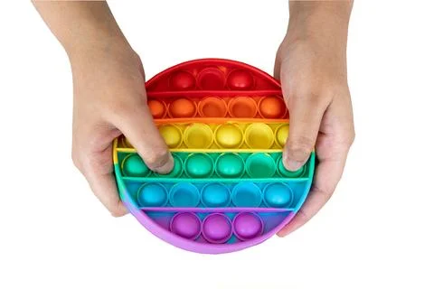 Hands playing with Popit Stock Photos