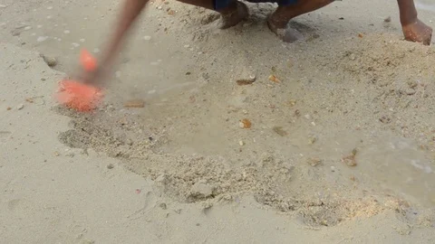 Hands playing with sand at the beach. Stock Footage 80675938