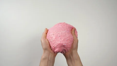 Hands playing with slime and hand wrap in slime by other hand, Close-up Top view Stock Footage 127391193