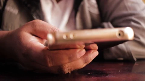 Hands playing smartphone Stock Footage 98617221