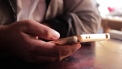 Hands playing smartphone Stock Footage 98617225
