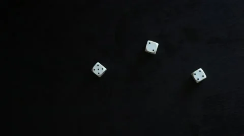 Hands playing white dice on black background 動画素材 65371620