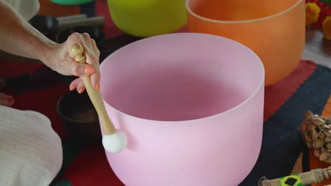 Hands playing on white quartz crystal singing bowls in the gazebo. Healing .. Stock Footage 341240851