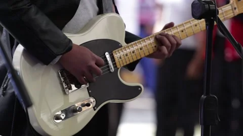 Hands playing a withe electric guitar at a live concert. Stock Footage 221662024