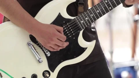 Hands playing a withe electric guitar at a live concert. Stock Footage 221662267
