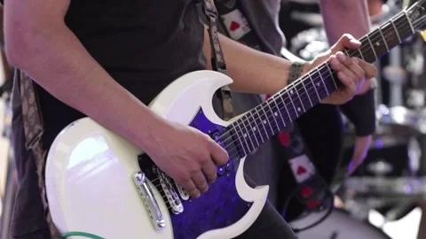 Hands playing a withe electric guitar at a live concert. Stock Footage 221662294