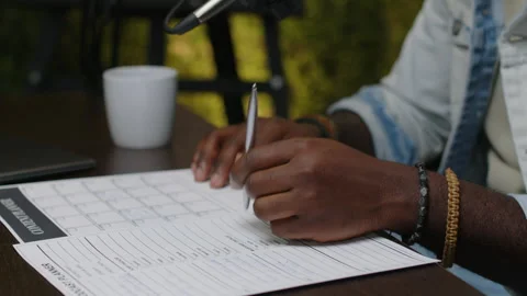 Hands of Podcaster Sitting with Papers at Desk in Recording Studio Stock Footage 270285097