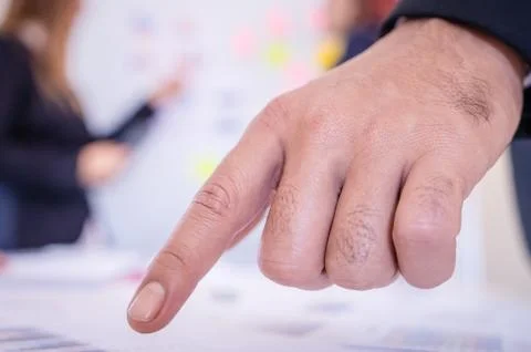 Hands pointing on data chart sheet for business meeting Stock Photos