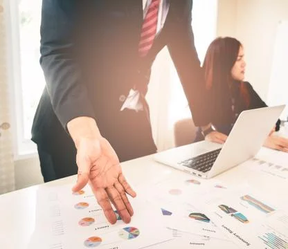Hands pointing on data chart sheet for business meeting Stock Photos