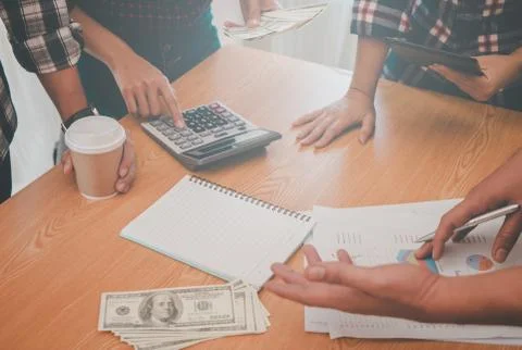 Hands pointing on data chart sheet for business meeting Stock Photos