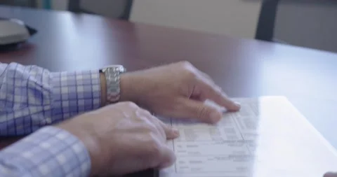 Hands Pointing at Papers Stock Footage 200790096