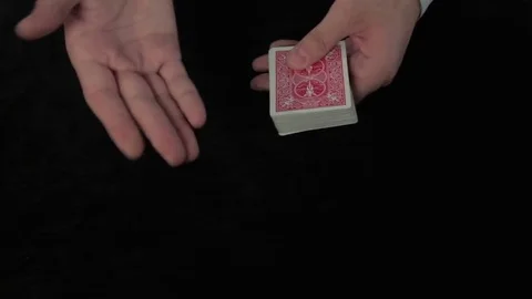 Hands on a poker table shuffling a deck of cards Stock Footage 73653847