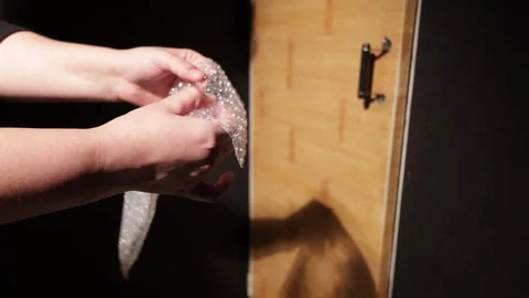 Hands popping bubble wrap for stress relief and satisfying ASMR sound Stock Footage 339175770