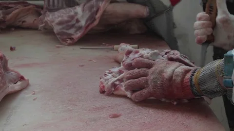 Hands, pork and sharp knife Stock Footage 81034625