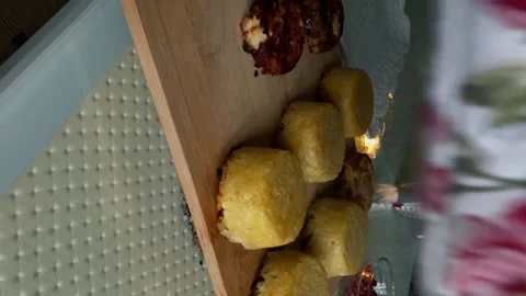 Hands in potholders turn over a form with hot tartlets Stock Footage 167506830