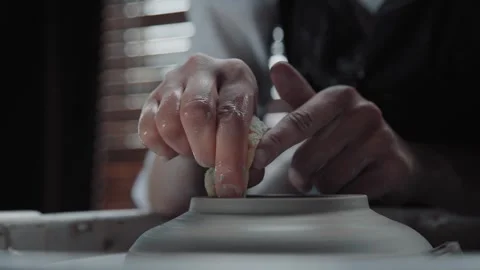 Hands of a potter and a clay jug. Medium shot. Stock Footage 257225877