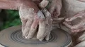 Hands of a potter and his apprentice HD Footage