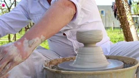 Hands of a potter, creating a clay jar Stock Footage 50735325