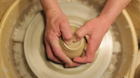 Hands of a potter, creating an earthen jar on the circle Stock-Footage 58144874