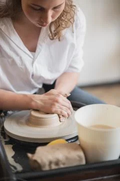 Hands of a potter, creating an earthen jar on the circle Stock Photos